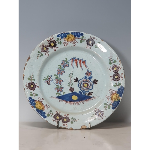 396 - Four Antique Delft Plates with polychrome decorations, one with Bird and Flowers, and three with Flo... 