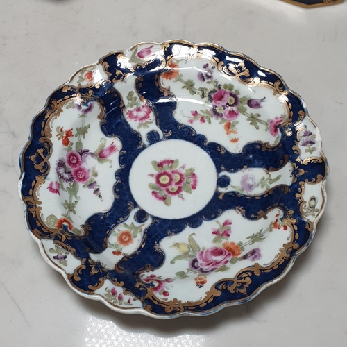 398 - A Worcester Plate with shaped rim, floral panels with blue and gilt borders, surface scratches, smal... 