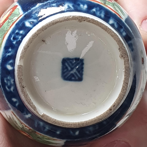 406 - A Worcester Coffee Can, Kakiemon design with blue square seal mark, a Worcester Coffee Can, blue and... 