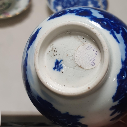 407 - A Worcester Cup and Saucer with moulded body, shaped rims, painted floral design, having blue border... 