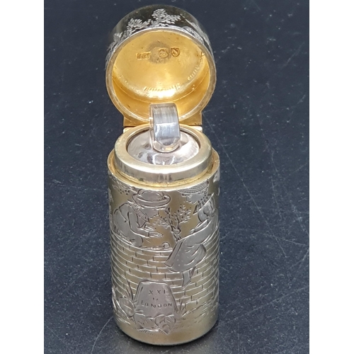 41 - A Victorian silver-gilt cylindrical Scent Bottle finely engraved with children in the manner of Kate... 