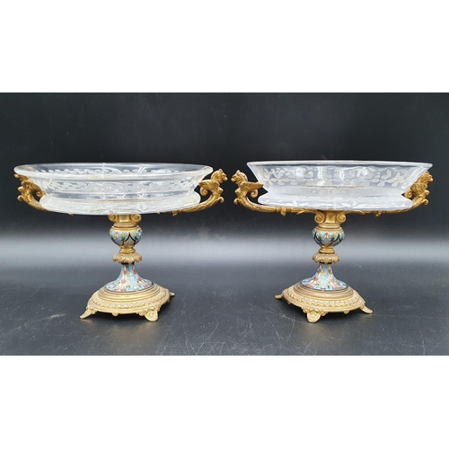 412 - A pair of gilt-metal, enamel and glass Tazzas with floral etched glass surmounts centred by blue, pi... 