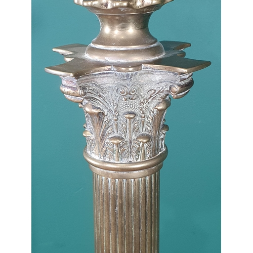 419 - A 19th Century Brass Lamp Standard with reeded corinthian column on stepped square base on claw supp... 