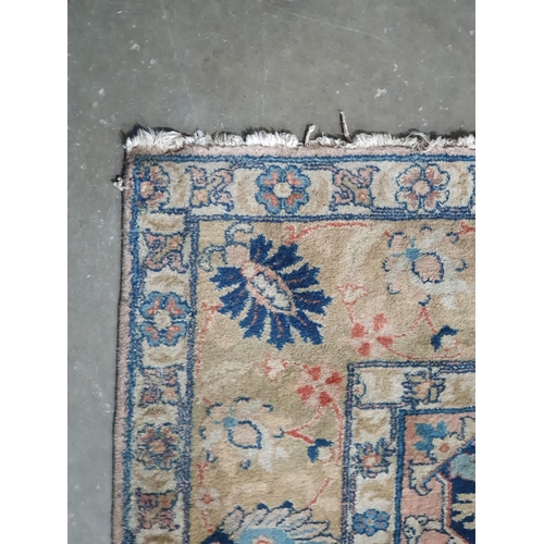 451 - A Persian Carpet with designs of flowers in colours to the border, the central ground decor stylised... 