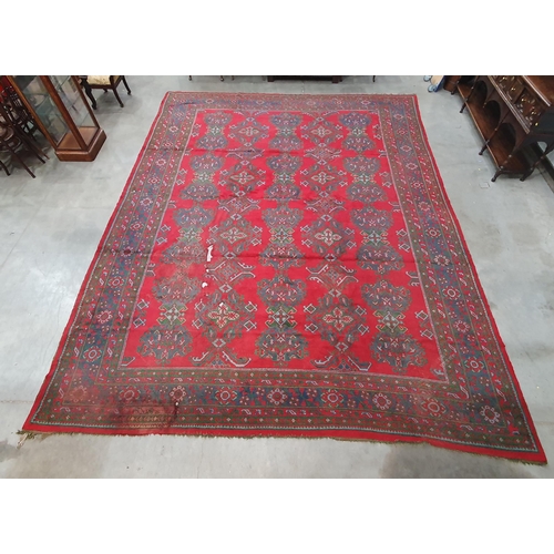 455 - A large Turkish wool Carpet, the multiple borders having stylised floral motifs and with medallion d... 