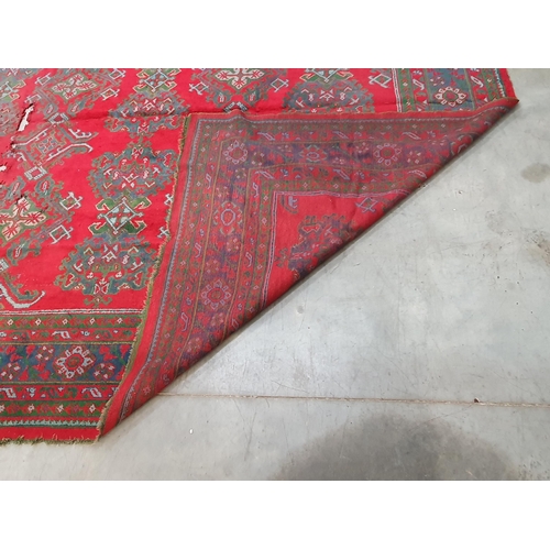 455 - A large Turkish wool Carpet, the multiple borders having stylised floral motifs and with medallion d... 