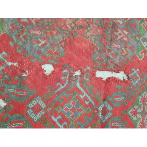 455 - A large Turkish wool Carpet, the multiple borders having stylised floral motifs and with medallion d... 