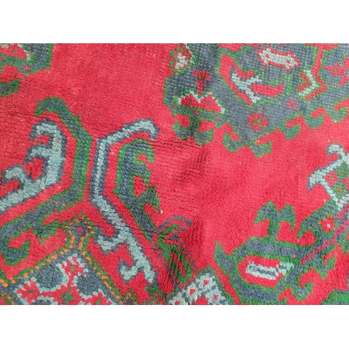 455 - A large Turkish wool Carpet, the multiple borders having stylised floral motifs and with medallion d... 