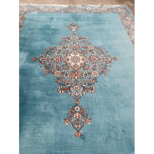 456 - A Chinese blue ground Carpet with central floral medallion and with floral scroll border in camel, r... 