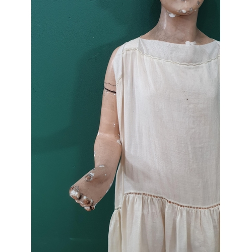 460 - An early 20th Century plaster covered, carved Shop Display Mannikin with removeable arms and painted... 