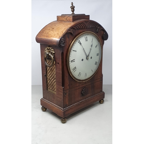 464 - A William IV rosewood Bracket Clock with circular enamel dial, brass Urn finial and ring handles rai... 