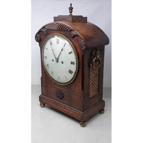 464 - A William IV rosewood Bracket Clock with circular enamel dial, brass Urn finial and ring handles rai... 