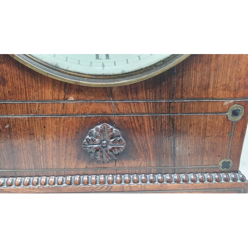 464 - A William IV rosewood Bracket Clock with circular enamel dial, brass Urn finial and ring handles rai... 