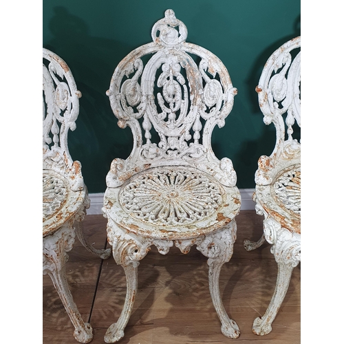 470 - A set of six 19th Century cast iron white painted Garden Chairs with shaped and pierced back, circul... 