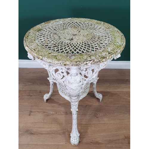 471 - A cast iron white painted circular Garden Table with pierced top, figural supports and paw supports,... 