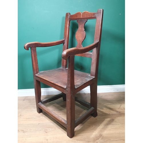 478 - An 18th Century Welsh oak Elbow Chair with vase splat back on square supports 3ft 6in H x 1ft 11in W