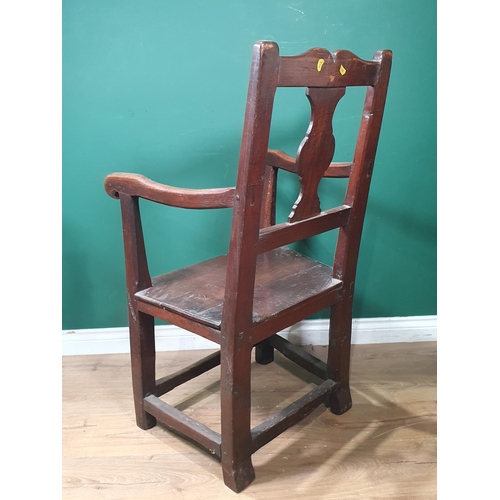 478 - An 18th Century Welsh oak Elbow Chair with vase splat back on square supports 3ft 6in H x 1ft 11in W