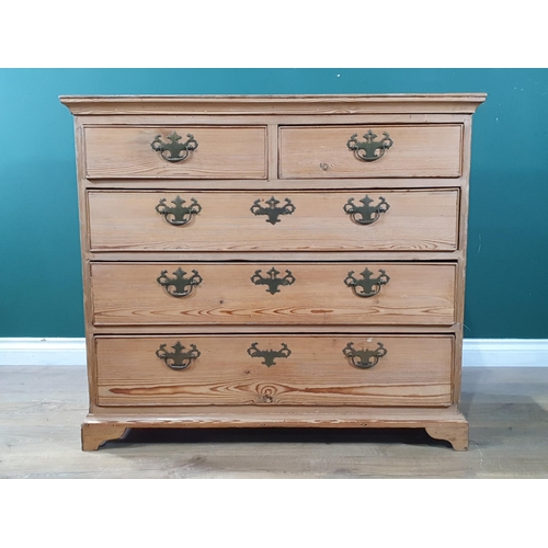 481 - A Georgian pine Chest of two short and three graduated long drawers mounted on ogee bracket feet 3ft... 