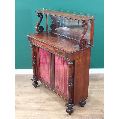 482 - A Victorian rosewood Chiffonier with mirrored shelf back and brass gallery above glazed and linen do... 