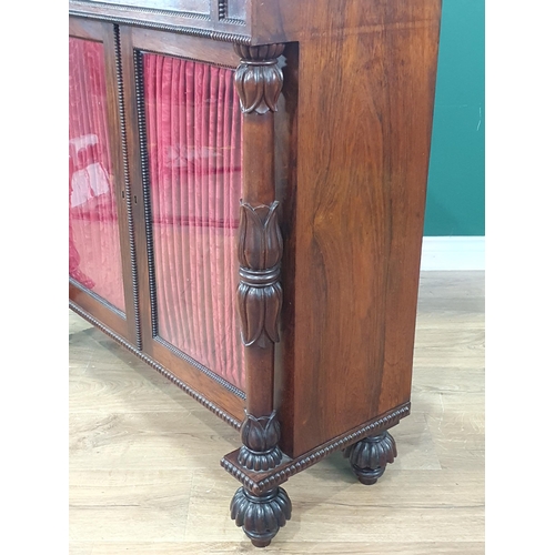 482 - A Victorian rosewood Chiffonier with mirrored shelf back and brass gallery above glazed and linen do... 