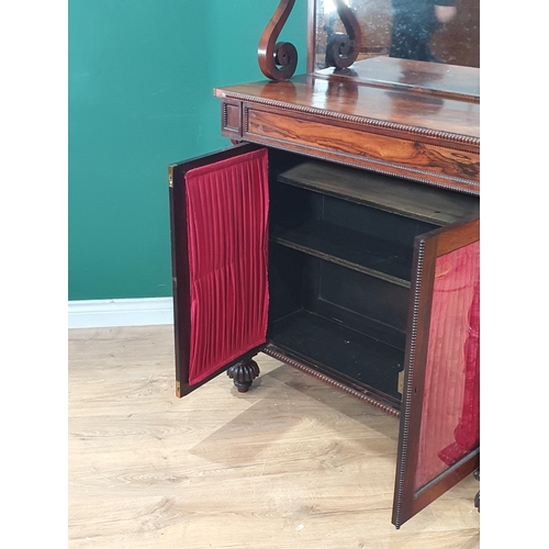 482 - A Victorian rosewood Chiffonier with mirrored shelf back and brass gallery above glazed and linen do... 