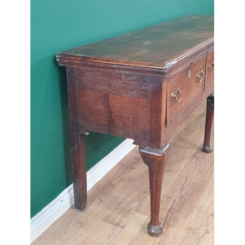 484 - An 18th century oak Dresser Base having cross-banded top above three cross-banded drawers on three c... 