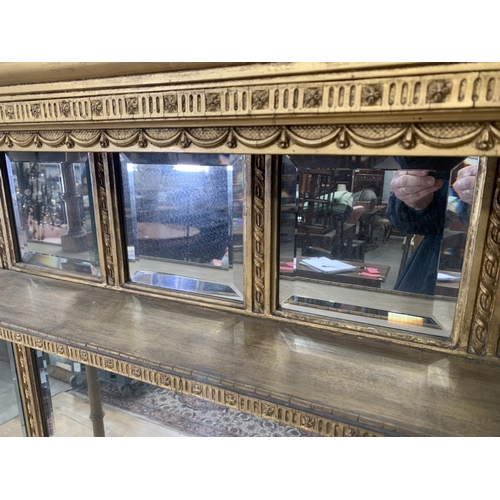 494 - A Georgian gilded Overmantle Mirror with a row of four small bevelled plates above two pairs of beve... 