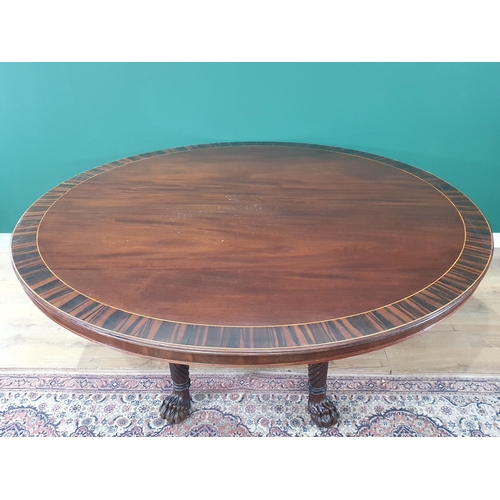 498 - A large Irish mahogany circular Dining Table with crossbanded top, raised on six spiral turned suppo... 