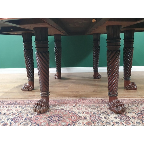 498 - A large Irish mahogany circular Dining Table with crossbanded top, raised on six spiral turned suppo... 