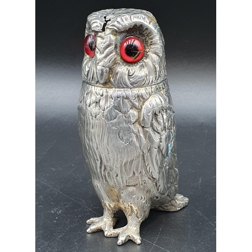 50 - A Victorian silver large owl Pepperette with coloured glass eyes, London 1862, maker: probably Georg... 