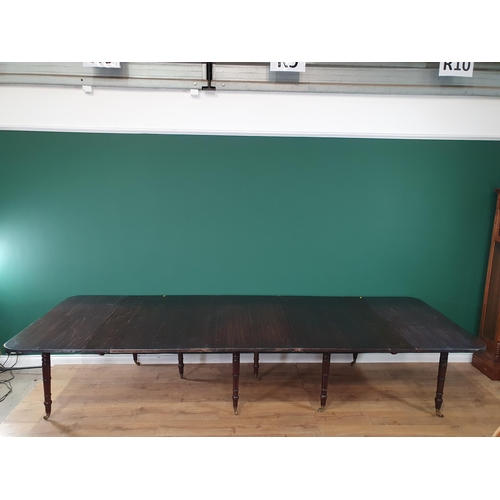 500 - A mahogany extending Dining Table, the rounded rectangular top with reeded edge and raised on eight ... 