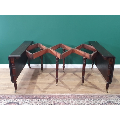 500 - A mahogany extending Dining Table, the rounded rectangular top with reeded edge and raised on eight ... 