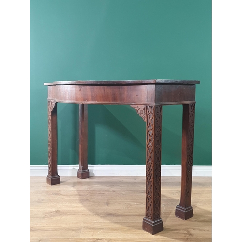 501 - An Irish mahogany Serpentine Serving Table raised on chamfered squared and blind fret carved support... 