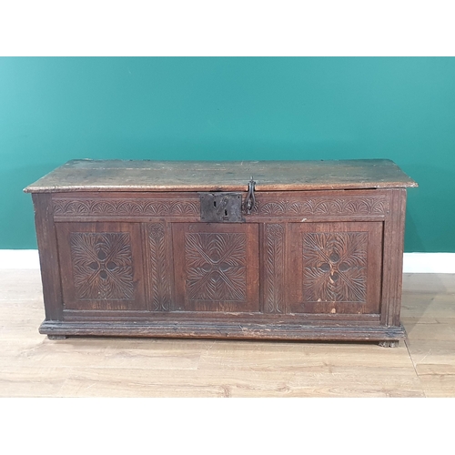 504 - A 17th C joined Oak Coffer with moulded two plank lid and clasp lock above quatrefoil leafage carved... 