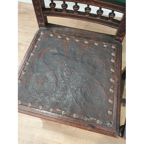 507 - A pair of 19th Century carved oak Hall Chairs with finely carved lion mask finials, tooled and embos... 