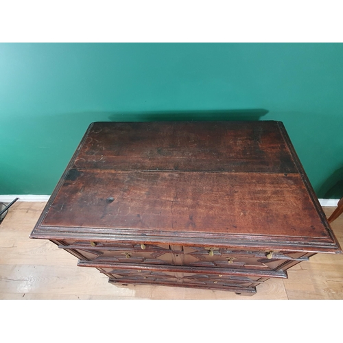 508 - A 17th Century oak Chest of two short and three long drawers with moulded top and geometric moulded ... 