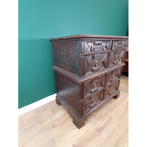 508 - A 17th Century oak Chest of two short and three long drawers with moulded top and geometric moulded ... 