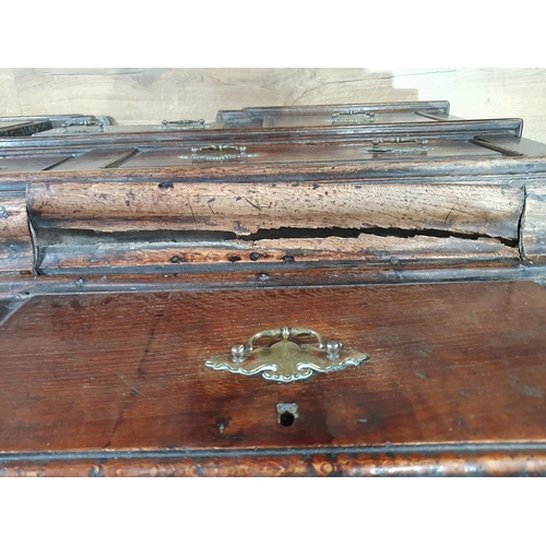 519 - An 18th Century oak Chest on Stand with an usual arrangement of four short drawers and a cupboard wi... 