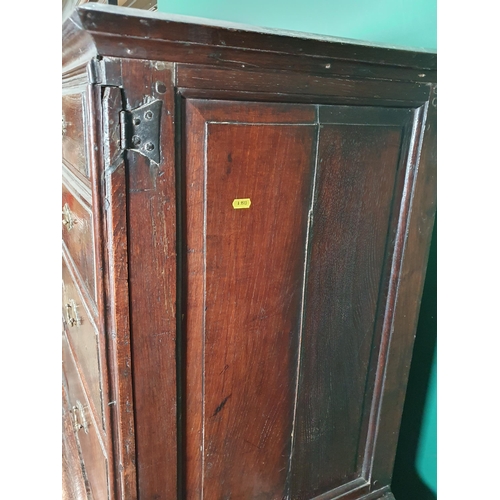 519 - An 18th Century oak Chest on Stand with an usual arrangement of four short drawers and a cupboard wi... 