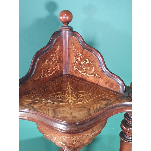 523 - A Victorian burr walnut four tier Corner Whatnot with scrolled satinwood inlay, raised on turned sup... 