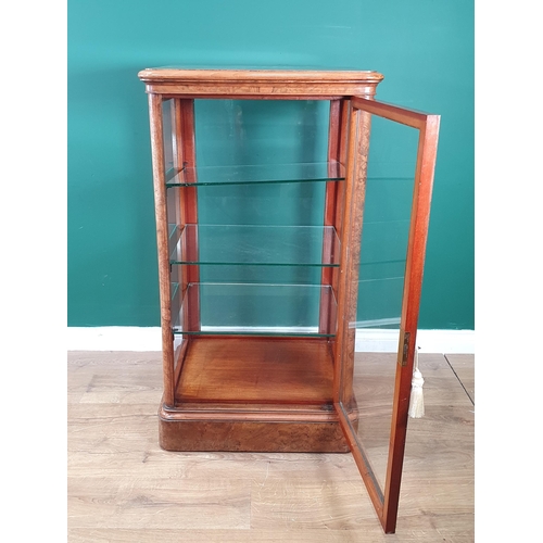 525 - A good quality late Victorian burr walnut Display Cabinet with moulded top above a single glazed doo... 