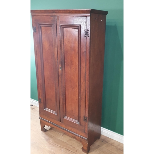 529 - An antique oak Cupboard with pair of panelled doors on bracket supports, 5ft 2