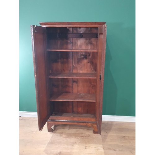 529 - An antique oak Cupboard with pair of panelled doors on bracket supports, 5ft 2