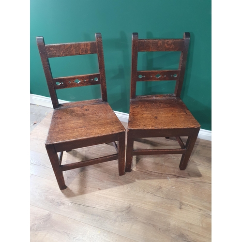 530 - A matched set of six antique oak Chairs with solid seats on squared supports and stretchers