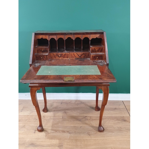 539 - An early 18th Century walnut Bureau on later Stand, the fall front enclosing fitted pigeonhole and d... 