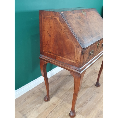 539 - An early 18th Century walnut Bureau on later Stand, the fall front enclosing fitted pigeonhole and d... 