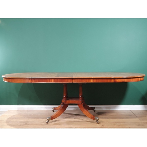 543 - A good quality mahogany extending Dining Table crossbanded in walnut, raised on a quadruple base wit... 