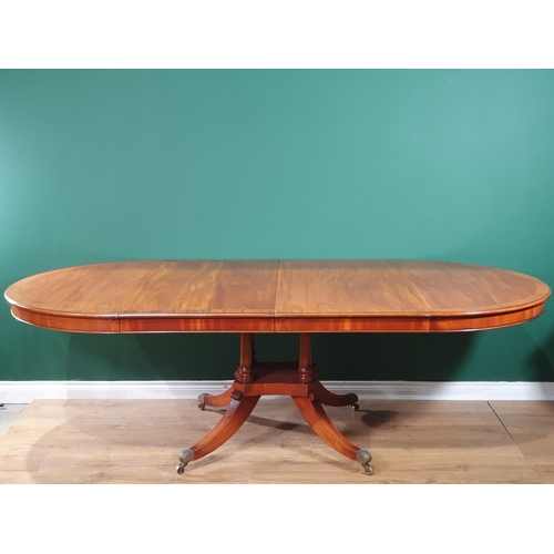 543 - A good quality mahogany extending Dining Table crossbanded in walnut, raised on a quadruple base wit... 