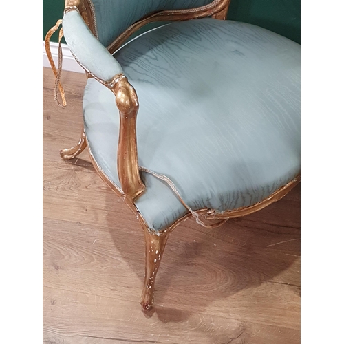 545 - A pair of 19th Century French giltwood Armchairs with shaped backs and seats and raised on cabriole ... 