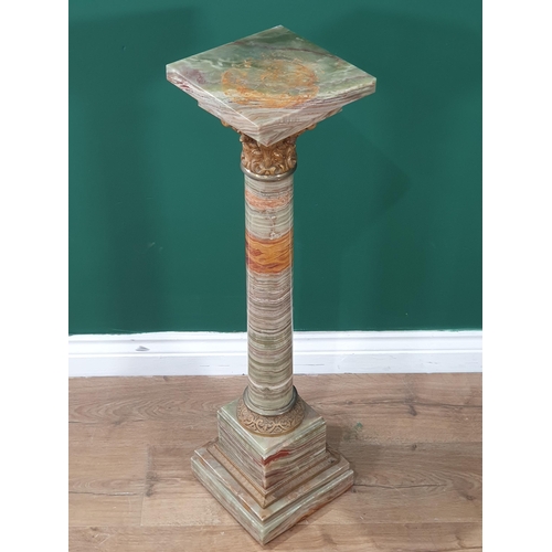 546 - A green and variegated marble Pedestal with square top on cylindrical column, gilt metal capital and... 